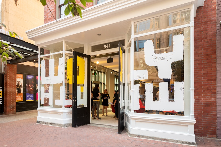 The exterior of Woolly Mammoth Theatre Company in Washington, DC with it doors open.