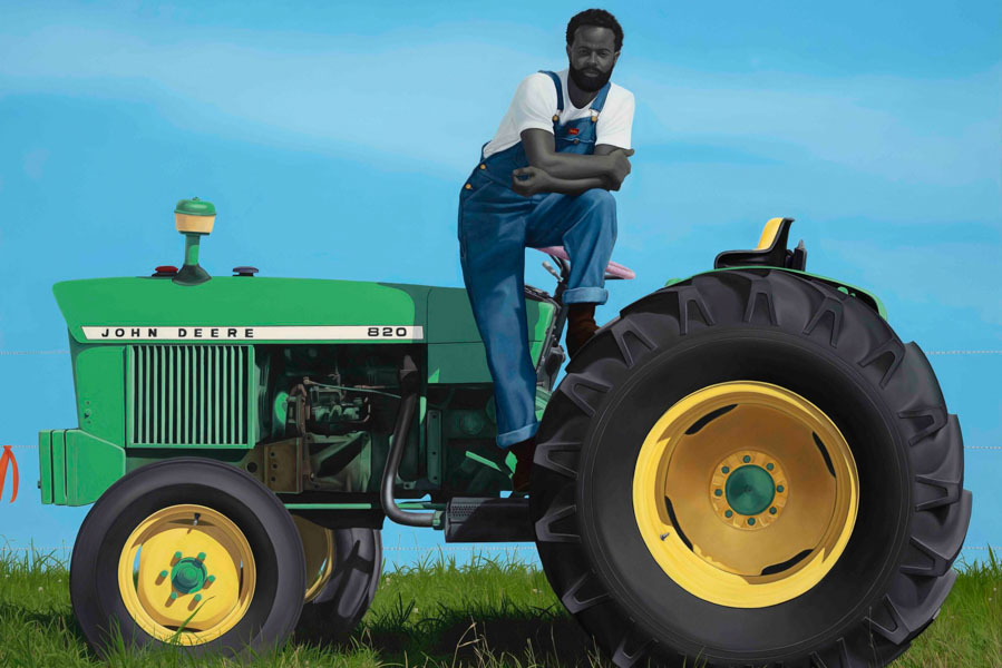 A painting of a man in overalls, seated on a tractor and looking at the viewer.