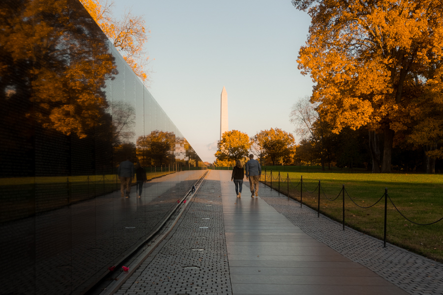 People walking across the Vietnam Veterans Memorial