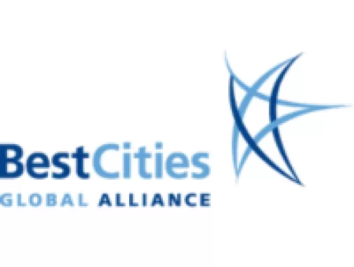 BestCities Global Alliance logo with the words 'BestCities' in bold blue text and 'GLOBAL ALLIANCE' in smaller uppercase letters, alongside an abstract blue star-like design.