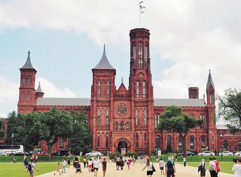 @travelwith_caro - Summer scene at the Smithsonian Castle on the National Mall - The best things to do this summer in Washington, DC
